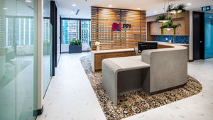 Office reception area with Babylon Light cluster hanging over desk