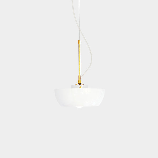 A ceiling-mounted pendant light with a white planter on the bottom and a brass spindle.