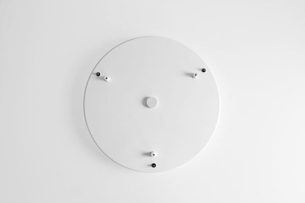 A white circular canopy with multiple mounting points for pendant lights or planters, viewed from above against a plain background.