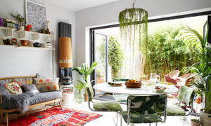 Babylon Light in a contemporary living dining area with lots of plants