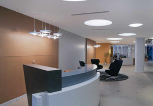 modern office reception area with a cluster of Babylon Lights hanging above reception desk