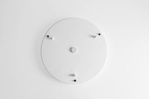 A white circular canopy with multiple mounting points for pendant lights or planters, viewed from above against a plain background.