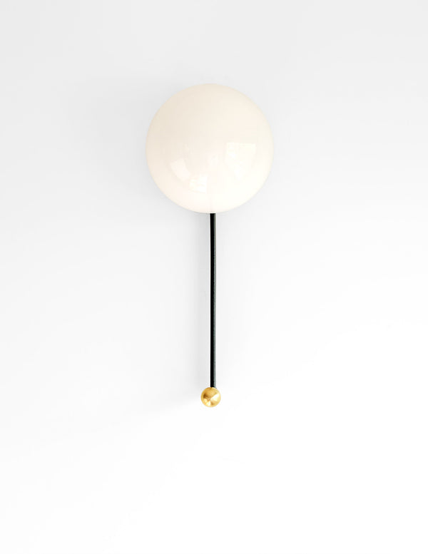 Hook Sconce with integrated hook seen here with brass knob