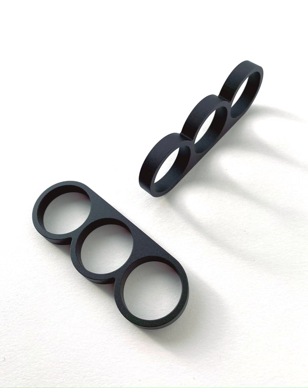Punch Pulls are cabinet and drawer pulls/knobs for kitchen and bathroom cabinets machined from aluminum with a black anodized finish